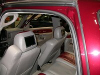 Custom two-tone leather seats with headrest monitors