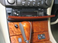 Clarion Pro Audio source unit custom-mounted in the factory CD changer location