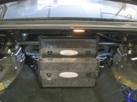 Zapco C2K amplifiers on custom steel amp rack with integrated rear strut bar