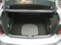 Two TREO SSi12 subwoofers in custom fiberglass enclosures with 'stealth' trim