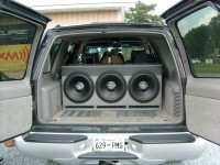 Barn doors open showing the TREO subwoofers inside